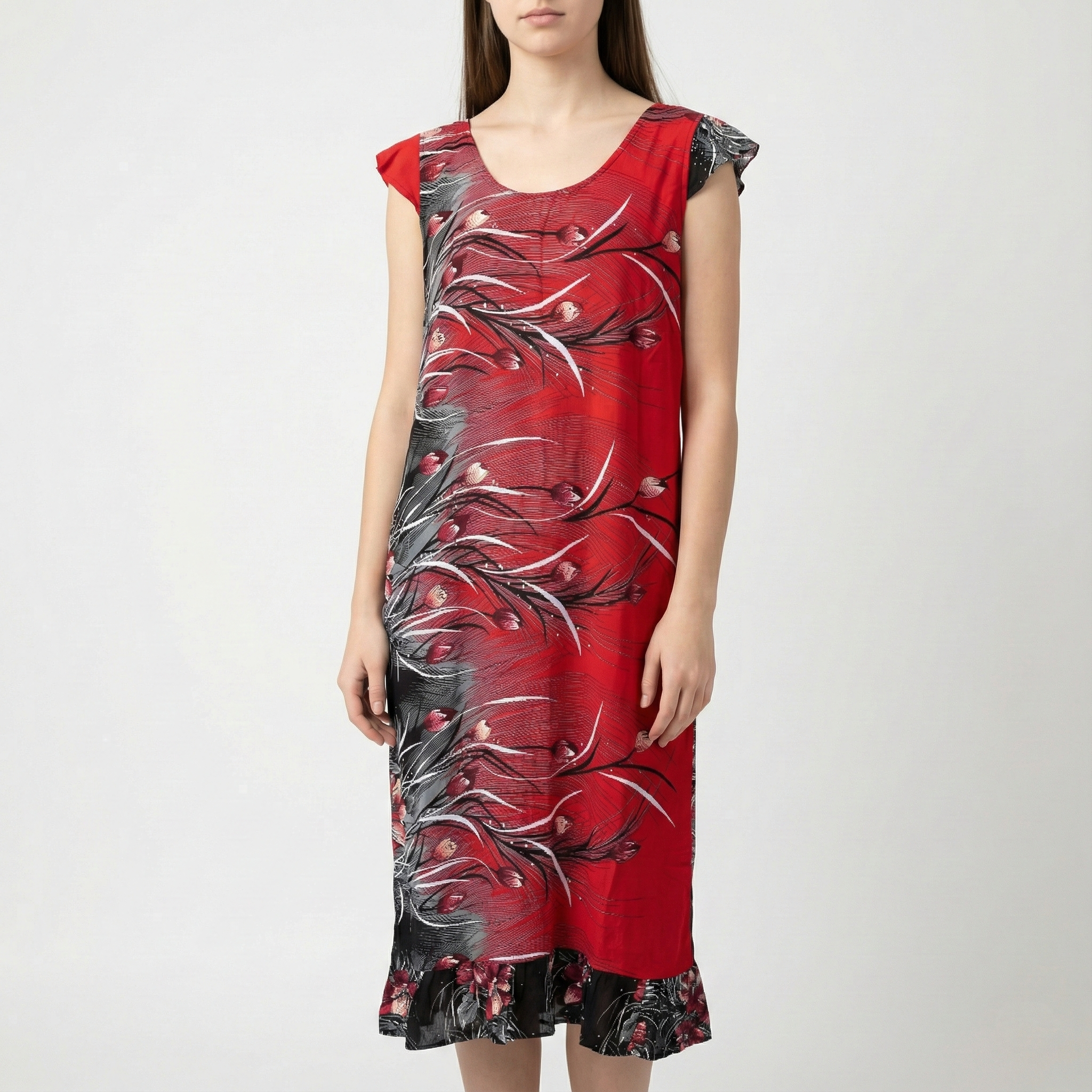 Manta Wayuu corta de color rojo con estampado de flores negras y grises, mangas tipo casquillo y detalle de bolero en el ruedo.