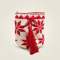 Mochila Wayuu tejida a mano con diseño geométrico rojo y blanco, acabado profesional con borla grande roja.
